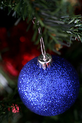 Image showing Christmas ornaments on tree.