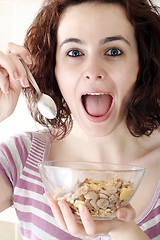 Image showing Young people eating milk with cereals