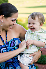 Image showing Happy Mother Holding Her Baby