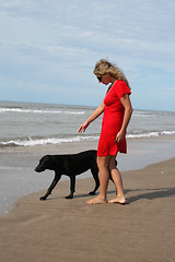 Image showing women in red and black dog