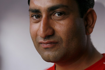 Image showing Handsome but serious Indian man looking straight into the camera