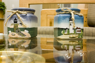 Image showing Lighthouse Candle Holders on glass table