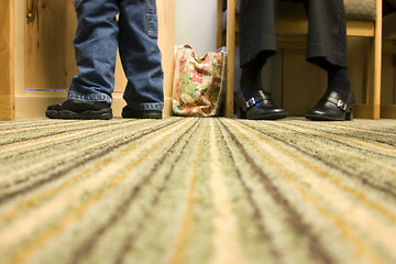 Image showing Floor Level Shot of Mom and Son at a Doctor's office