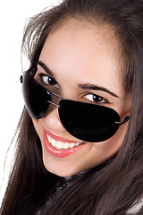 Image showing Portrait of the smiling girl in sunglasses. Isolated