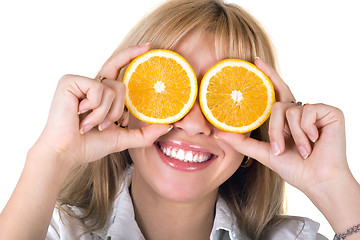 Image showing Portrait of the funny smiling girl with oranges. Isolated
