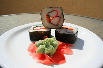 Image showing Sushi next to Wasabi and Sushi Ginger