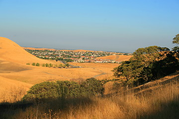 Image showing Windy Road into a City