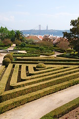 Image showing Enchanted Ajuda garden with April 25th bridge in Lisbon, Portugal