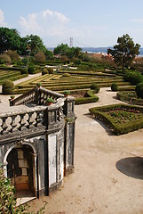 Image showing Enchanted Ajuda garden with April 25th bridge in Lisbon, Portugal