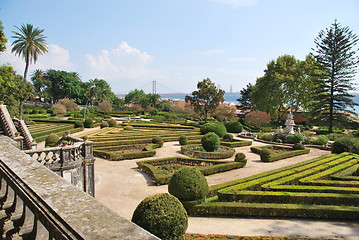 Image showing Enchanted Ajuda garden with April 25th bridge in Lisbon, Portugal