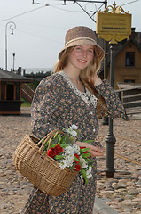 Image showing Girl with basket of flowers