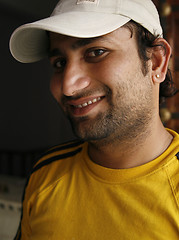 Image showing Smiling Indian man in a casual sporty outfit