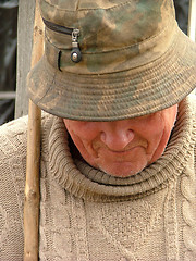 Image showing Old man with a hat and a walking stick