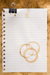 Image showing Paper with coffee stains and clip