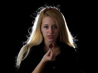 Image showing Girl eating strawberry