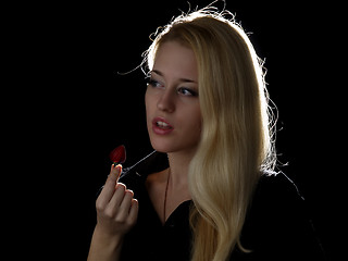 Image showing Girl eating strawberry