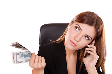 Image showing young woman holding money in the hand