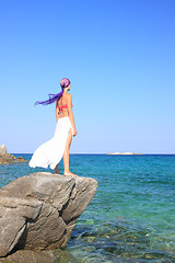 Image showing tanned woman in bikini in the sea