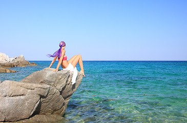 Image showing tanned woman in bikini in the sea