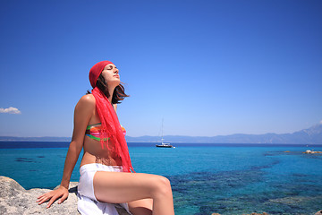 Image showing tanned woman in bikini in the sea