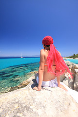 Image showing tanned woman in bikini in the sea