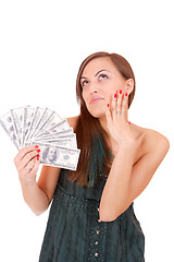 Image showing Attractive woman takes lot of 100 dollar bills