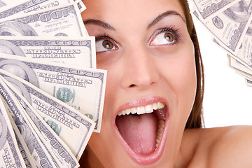 Image showing Attractive woman takes lot of 100 dollar bills