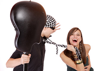 Image showing Handsome young male and female musicians, performers with guitar