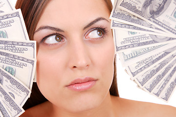 Image showing Attractive woman takes lot of 100 dollar bills