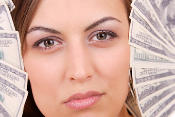 Image showing Attractive woman takes lot of 100 dollar bills