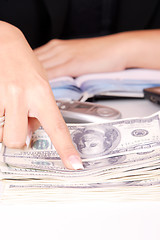 Image showing The businesswoman pointing at money
