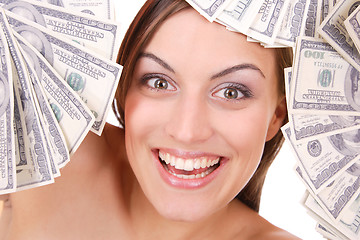 Image showing Attractive woman takes lot of 100 dollar bills