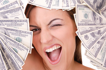 Image showing Attractive woman takes lot of 100 dollar bills