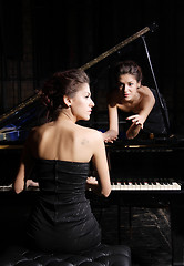 Image showing woman playing piano