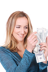 Image showing young woman holding money in the hand