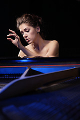 Image showing woman playing piano