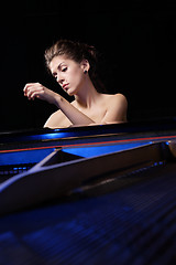 Image showing woman playing piano