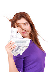 Image showing young woman holding money in the hand