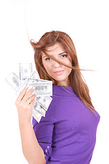 Image showing young woman holding money in the hand