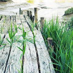 Image showing Old planks of a footbridge