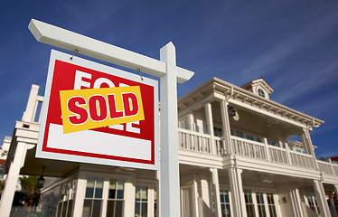 Image showing Sold Home For Sale Sign in Front of New House 
