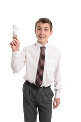 Image showing School boy holding a light bulb
