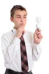 Image showing Student holding light globe needing ideas