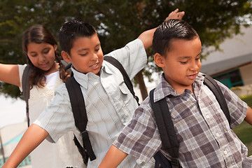 Image showing Cute Brothers and Sister Having Fun Walking to School