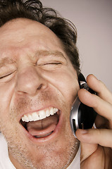 Image showing Ecstatically Happy Man on Cell Phone