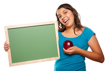 Image showing Pretty Hispanic Girl Holding Blank Chalkboard and Apple