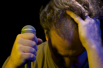 Image showing Passionate Vocalist & Microphone