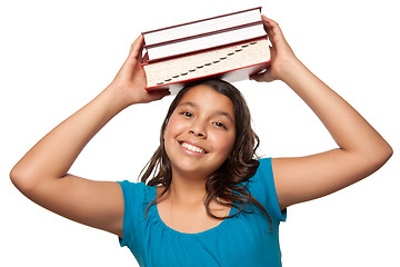 Image showing Pretty Hispanic Girl with Books on Her Head