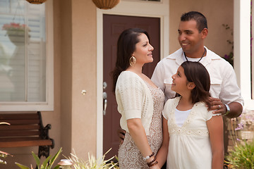 Image showing Small Hispanic Family in Front of Their Home