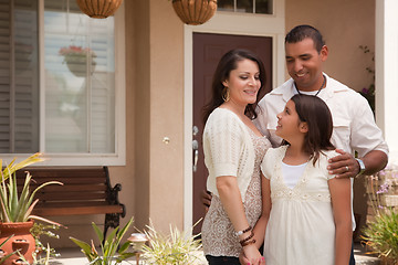 Image showing Small Hispanic Family in Front of Their Home